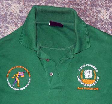 A green polo shirt with embroidered designs

Description automatically generated with low confidence