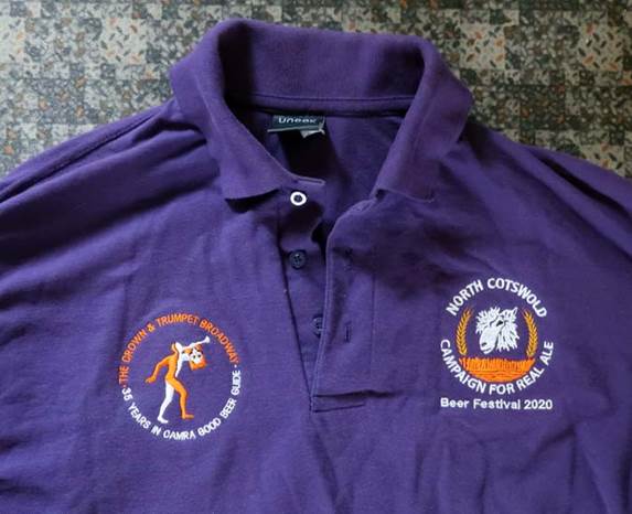 A purple polo shirt with a cartoon character on it

Description automatically generated with low confidence