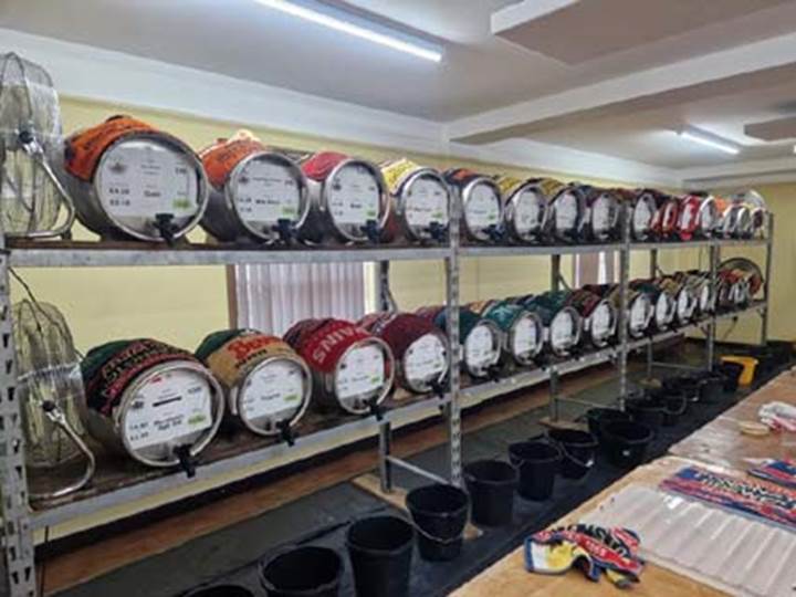 Rows of barrels on shelves

AI-generated content may be incorrect.