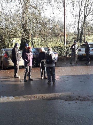 A group of people standing in a parking lot

Description automatically generated with low confidence