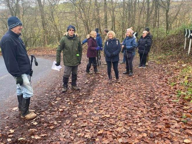 A group of people walking in a forest

Description automatically generated with medium confidence