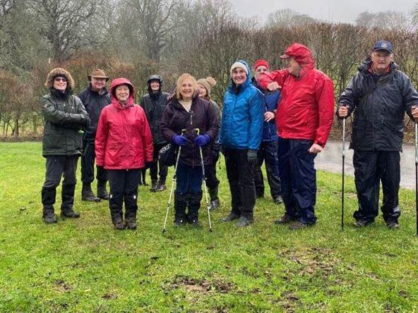 A group of people standing in a field

Description automatically generated with low confidence